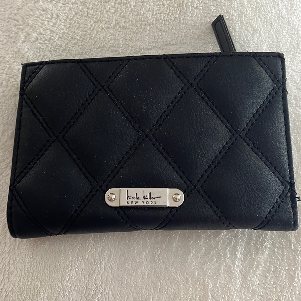 Perfect wallet- space for 16 cards, dollar bills & change & it snaps shut!
